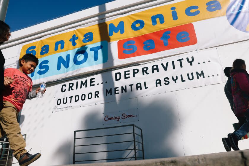 Los Angeles, CA - December 20: A sign reads "Santa Monica is Not Safe," has sparked controversy on Third Street Promenade on Tuesday, Dec. 20, 2022 in Los Angeles, CA. One property owner says it's meant to draw attention, especially to city officials he blames for turning a blind eye to homelessness and crime. (Dania Maxwell / Los Angeles Times)