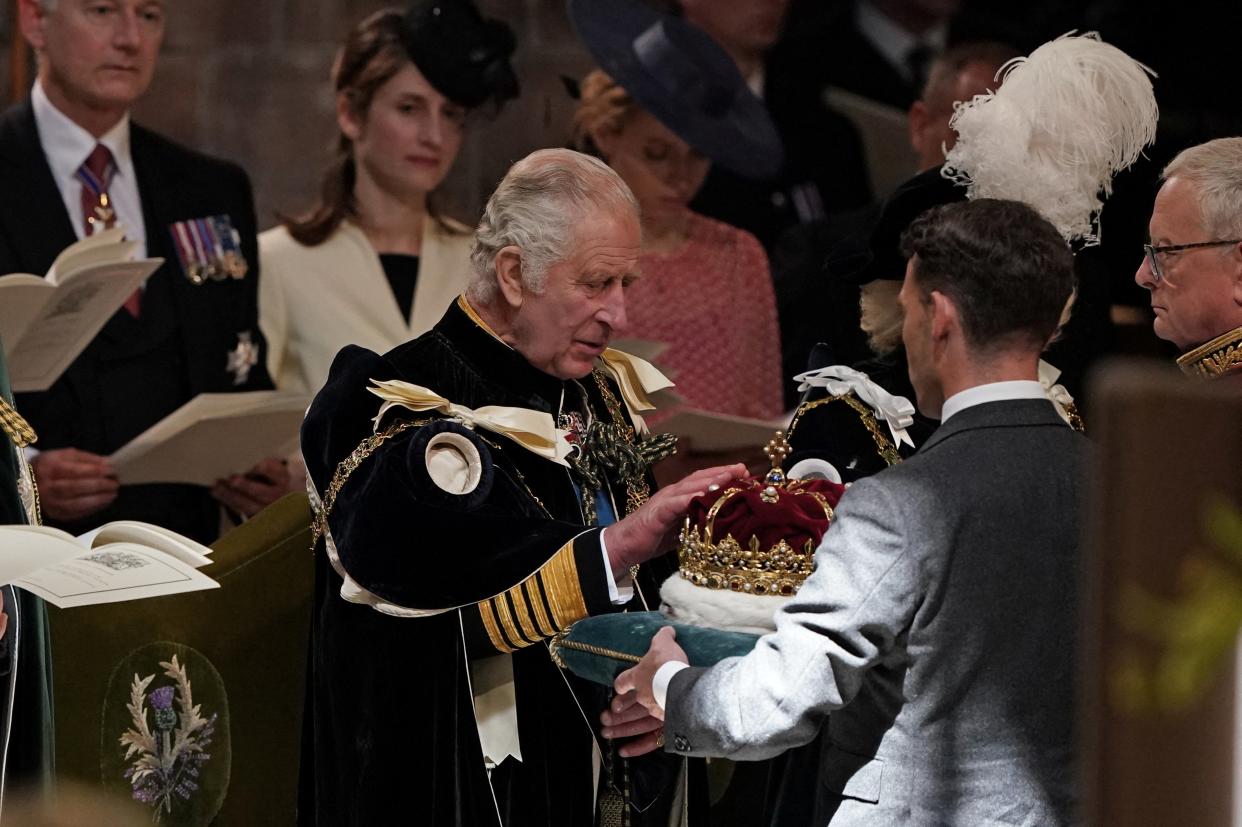 Britain's King Charles III is presented with the Crown of Scotland (via REUTERS)