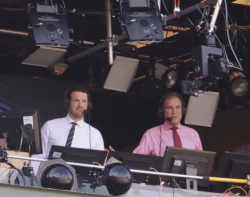 Tony Romo and Jim Nantz work in the CBS broadcast booth before a game between the Green Bay Packers and the Cincinnati Bengals. Nantz and Romo were inseparable when CBS broadcast the Super Bowl two years ago. Next week, they won't see each other until they are in the broadcast booth a couple hours prior to kickoff. Keeping announcers separated until game day has been standard practice this season due to the Coronavirus pandemic.