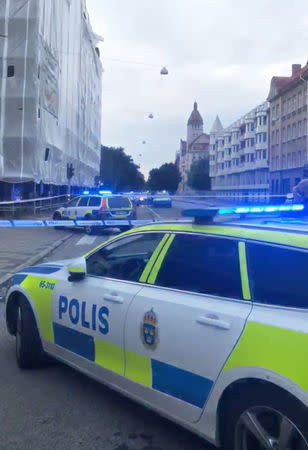 People are seen following the night shooting incident in Malmo, Sweden June 18 2018, in this picture grab obtained from social media video. Philip Stenkula via REUTERS