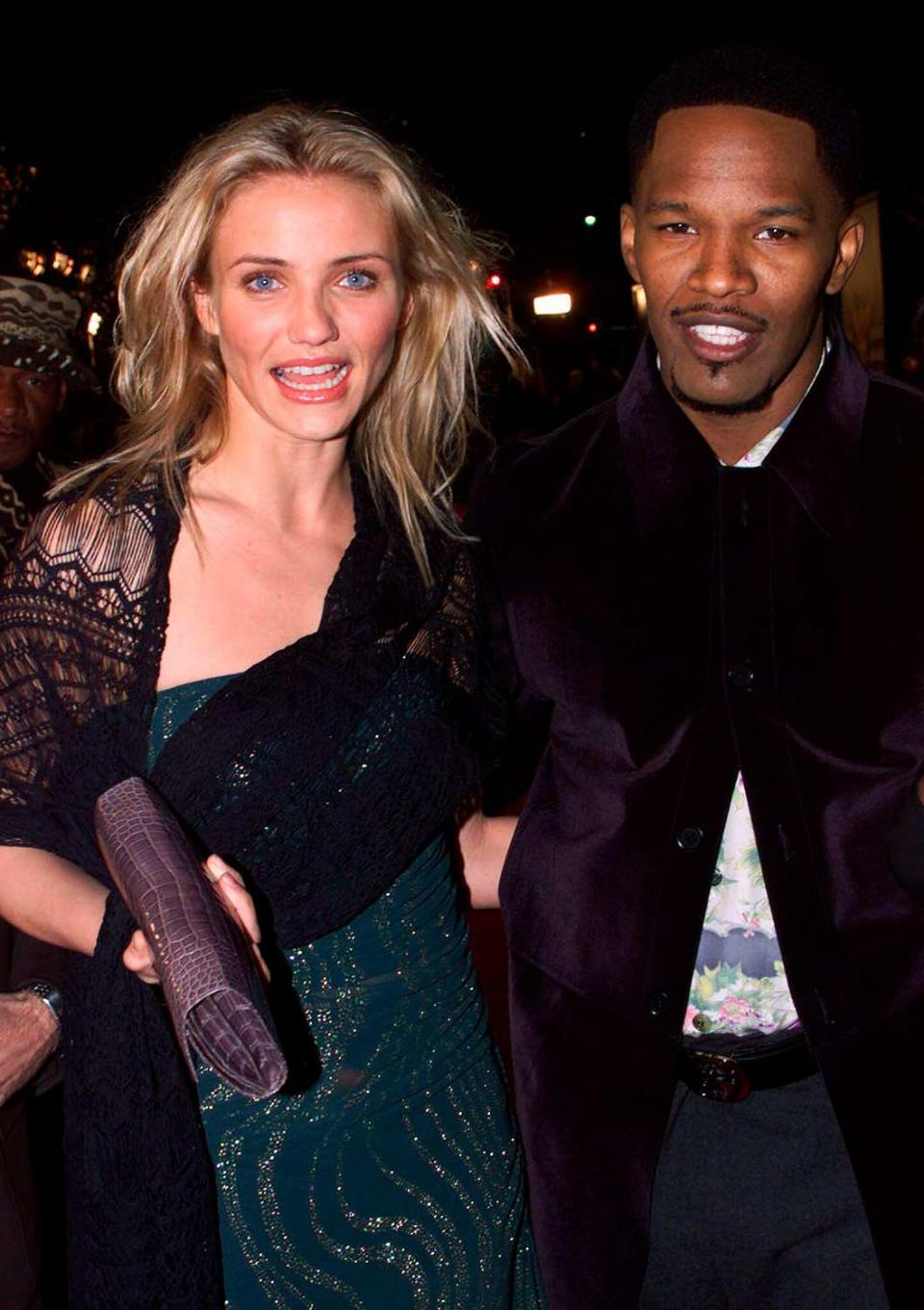 1999--Actors Cameron Diaz and Jamie Foxx, stars of the new film by director Oliver Stone, Any Given Sunday pose at the film's premiere December 16 in Los Angeles. Diaz portrays football team owner Christina Pagniacci and Foxx portrays Willie Beaman, a third-string quarterback in the film about the world of professional football, which also stars Al Pacino and Dennis Quaid. FSP