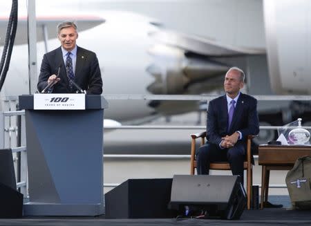 FILE: Ray Conner (L), Boeing Commercial Airplanes President and CEO, speaks as Dennis Muilenburg, Boeing Chairman, President and CEO, looks on during ceremonies marking the centennial of The Boeing Company in Seattle, Washington July 15, 2016. REUTERS/Jason Redmond