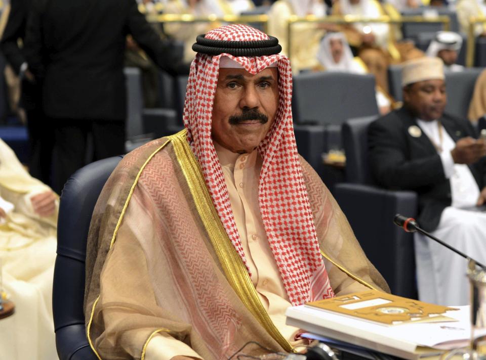 FILE - Kuwait's then-Crown Prince Sheik Nawaf Al-Ahmad Al-Jaber Al-Sabah attends the closing session of the 25th Arab Summit in Bayan Palace in Kuwait City, Wednesday, March 26, 2014. Kuwait's ruling emir, the 86-year-old Sheikh Nawaf Al Ahmad Al Sabah, has died, state television reported Saturday, Dec. 16, 2023. (AP Photo/Nasser Waggi, File)