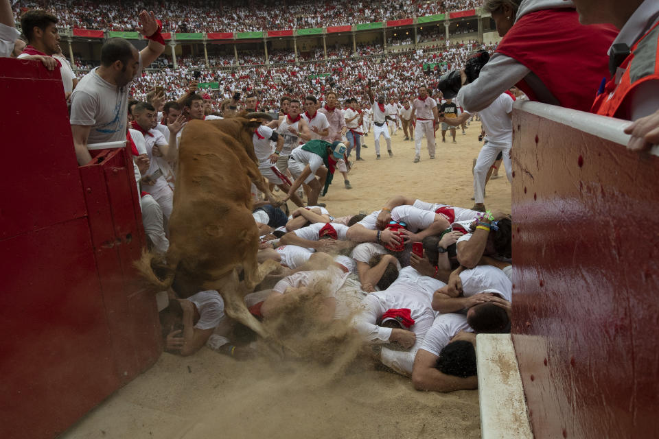 A heifer jumps over revellers in the bullring during the second day of the San Fermin Running of the Bulls festival on July 7, 2019 in Pamplona, Spain. (Photo: Pablo Blazquez Dominguez/Getty Images)