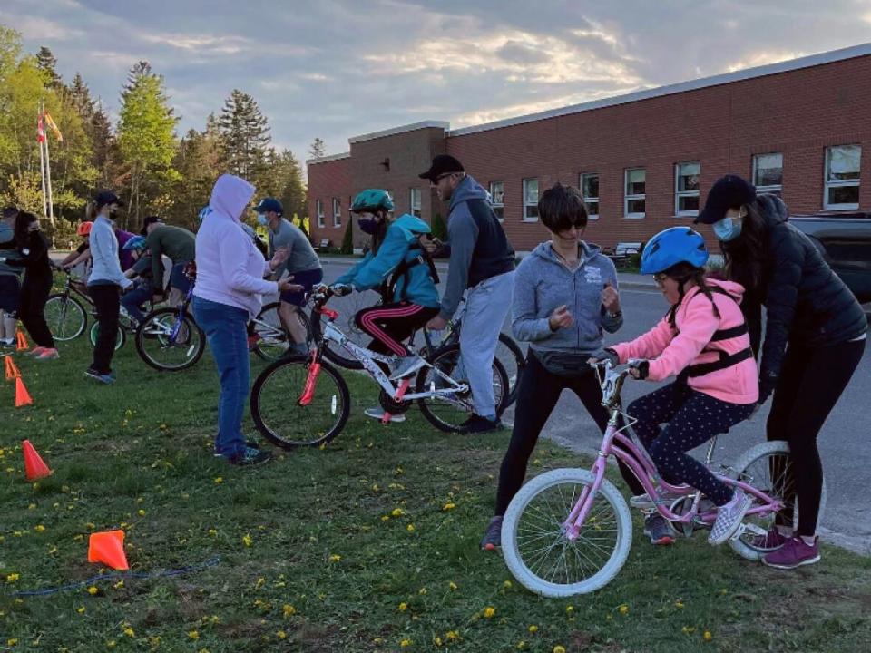 On the first day, kids get fitted for their bikes and learn how to balance. (Sue Lawton/Submitted - image credit)