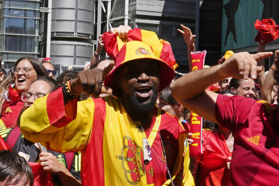 Spanish fans celebrate in a street, in Madrid, Spain, Sunday, Aug. 20, 2023, after Spain won against England in the Women's World Cup final soccer match played in Australia. (AP Photo/Paul White)