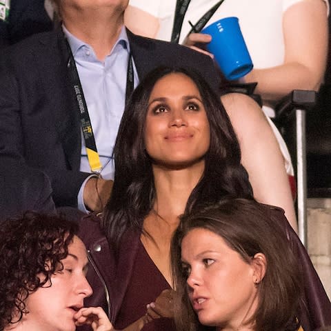 US actress Meghan Markle watches the opening ceremonies of the third Invictus Games in Toronto - Credit: EPA