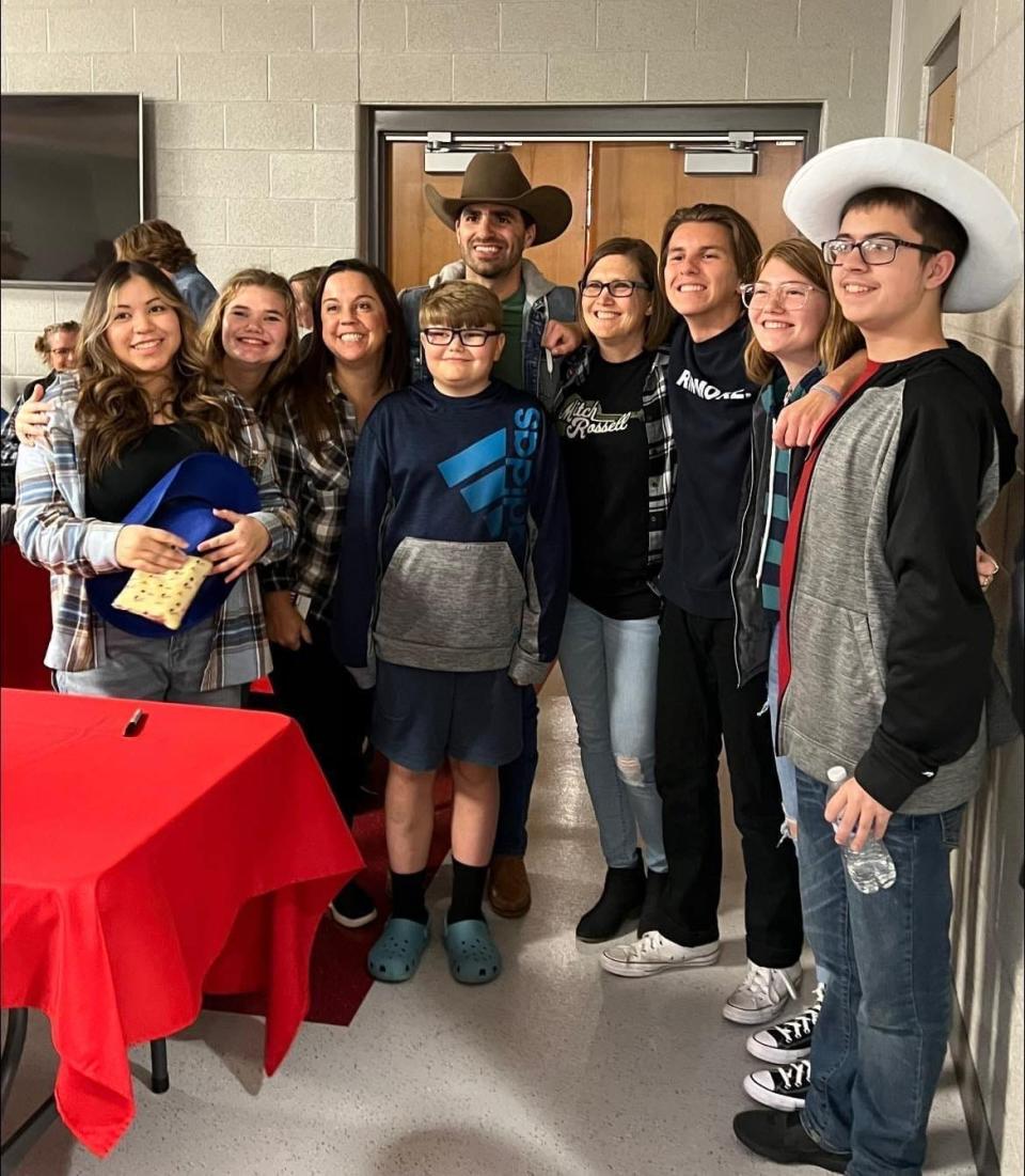 Country music artist Mitch Rossell is shown with Canton Local Schools students following his concert in November at Canton South High School.