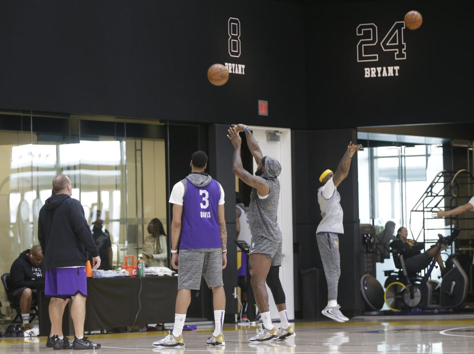 Los Angeles Lakers forward LeBron James, center, and other team members work out during NBA basketball practice in El Segundo, Calif., Thursday, Jan. 30, 2020. The Lakers held their second practice Thursday, while they continue to grieve for former player Kobe Bryant. (AP Photo/Damian Dovarganes)