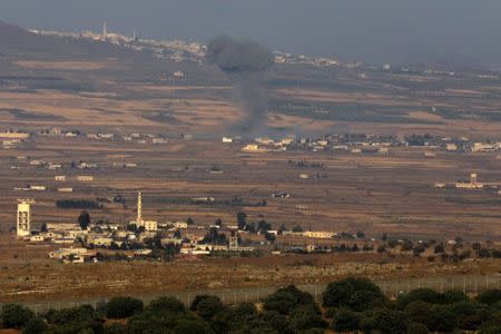 Smoke following an explosion in Syria is seen from the Israeli-occupied Golan Heights near the Israeli Syrian border July 16, 2018. REUTERS/Ronen Zvulun