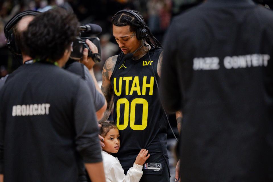 Callie Clarkson hugs her father, Utah Jazz guard Jordan Clarkson (00), while he talks to the press after the NBA basketball game between the Utah Jazz and the Dallas Mavericks at the Delta Center in Salt Lake City on Monday, Jan. 1, 2024. Clarkson got a triple double and the Jazz won the game 127-90. | Megan Nielsen, Deseret News