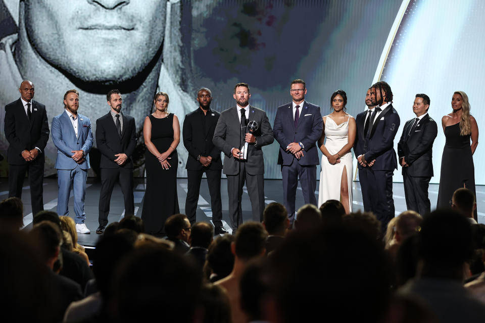 Damar Hamlin of the Buffalo Bills presents the Pat Tillman Award for Service to the trainers of the Bills at the ESPY awards in Los Angeles on Wednesday. (ABC)