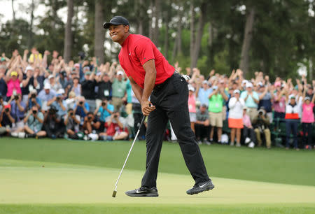 Golf - Masters - Augusta National Golf Club - Augusta, Georgia, U.S. - April 14, 2019. Tiger Woods of the U.S. celebrates on the 18th hole to win the 2019 Masters. REUTERS/Lucy Nicholson