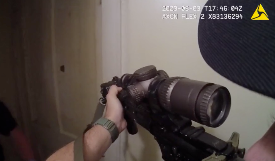 In this screenshot of body camera footage from the Alliance Police Department,  officer Robert Toussant stood ready in the hallway of an apartment on South Linden Avenue on Sept. 3, 2023. Toussant later shot and killed George "Joe" Appleby, who was holding a knife against a woman inside the apartment.