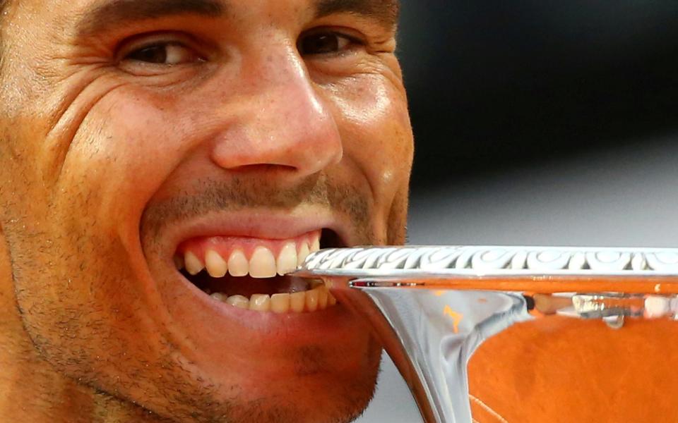 The whole tooth: Spain's Rafael Nadal celebrates with the trophy after winning the Rome final against Germany's Alexander Zverev - REUTERS