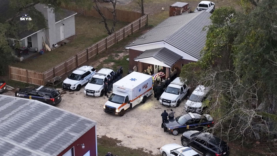 Police escort the body of George County Deputy Jeremy Malone from the George County Courthouse to the Mississippi Forensics Lab in Biloxi on Friday, Jan. 5, 2024. Malone was killed after he stopped a vehicle on Thursday. (WKRG-TV via AP)