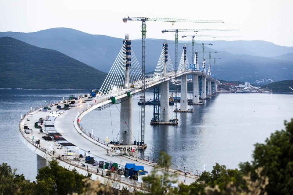 A view of the construction of Peljesac Bridge in Komarna, Croatia, Wednesday, July 28, 2021. European Union-funded Peljesac Bridge in southern Croatia that has been built by a Chinese state-owned company was opened late Wednesday. The bridge was designed to connect two swaths of Adriatic Sea coastline and passes over a small stretch of Bosnia's territory. (AP Photo)