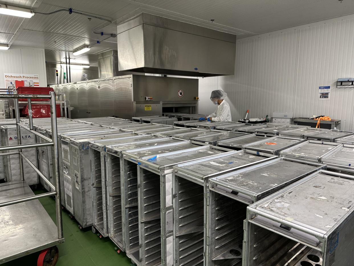 Catering carts waiting to be washed and inspected. The cart washing machine can handle about 250 carts per hour.