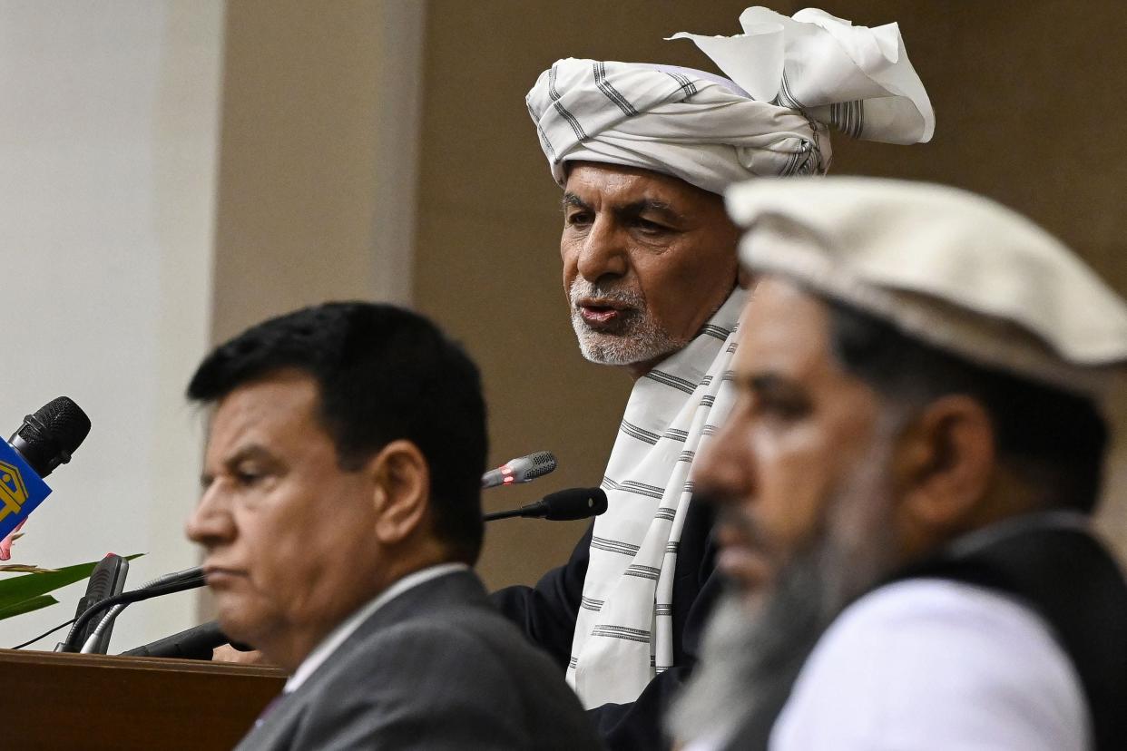 President Ashraf Ghani, centre, speaks during a meeting at the Afghan Parliament house in Kabul  (AFP via Getty Images)