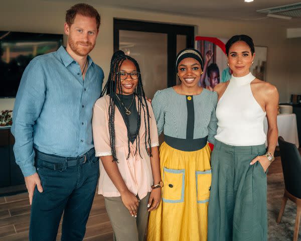 <p>Musa Pem/Save the Children</p> Prince Harry (left) and Meghan Markle (right) pose with Save the Children Youth Ambassadors Purity and Maryam in Abuja, Nigeria, in May 2024.