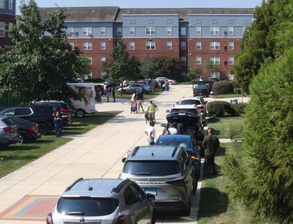 Wide sidewalks and grassy areas normally barred to traffic are open to vehicles as upperclassmen move in to the University Village section on the Delaware State University campus in Dover, Saturday, August 26, 2023.