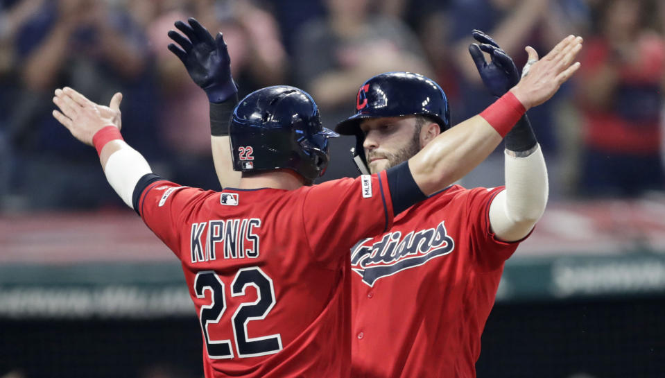 Cleveland Indians' Tyler Naquin, right, celebrates with Jason Kipnis after Naquin hit a two-run home run in the sixth inning of a baseball game against the Kansas City Royals, Tuesday, June 25, 2019, in Cleveland. Kipnis scored on the play. (AP Photo/Tony Dejak)