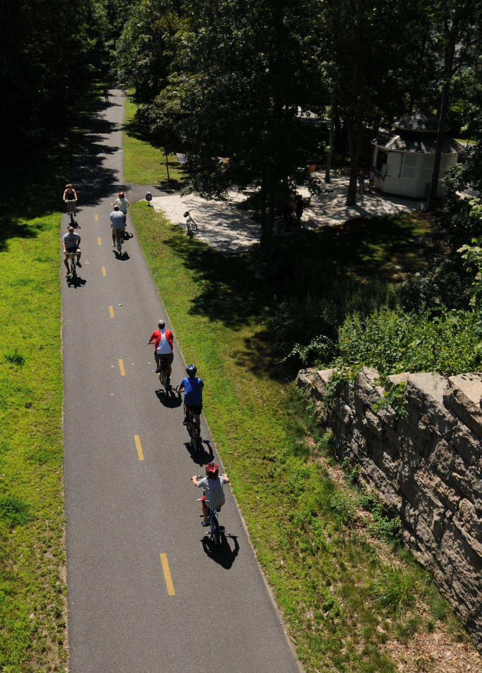 Bicyclists ride the Shining Sea bike path near Carlson Lane in Falmouth.