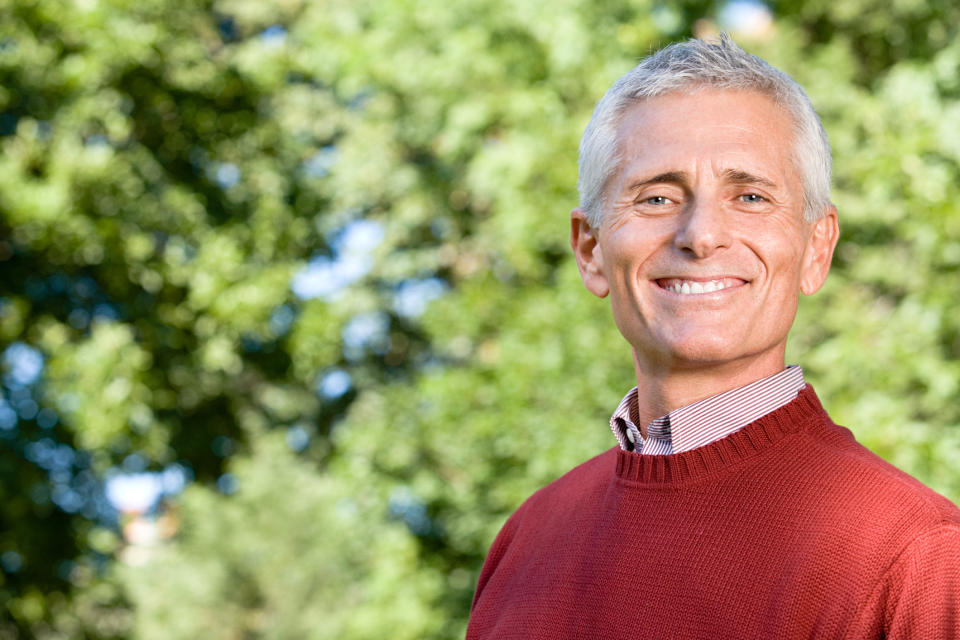 Smiling older man in outdoor setting