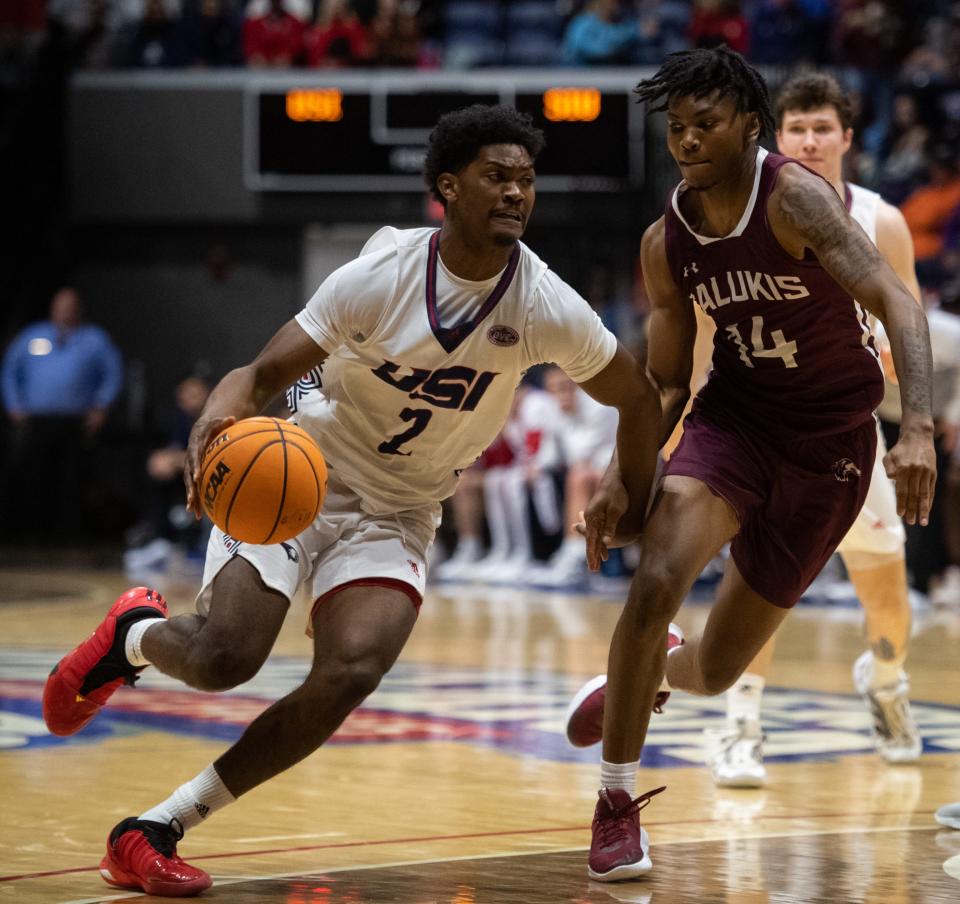 Southern Indiana’s Gary Solomon (2) drives the ball as the University of Southern Indiana Screaming Eagles play the Southern Illinois Salukis at Screaming Eagles Arena in Evansville, Ind., Sunday afternoon, Nov. 13, 2022. 