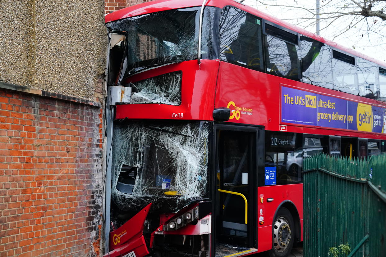 Emergency services at the scene on The Broadway in Highams Park, east London, where a number of people are being treated by paramedics from the London Ambulance Service after a bus collided with a building. Picture date: Tuesday January 25, 2022.