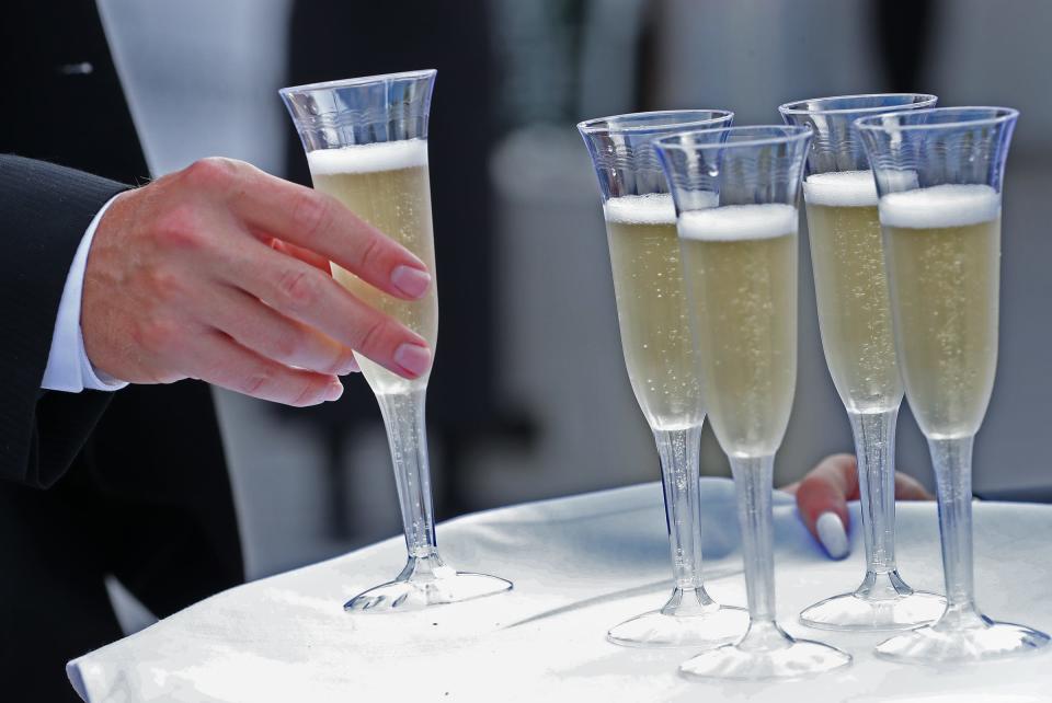 Champagne flows during Rev, Saturday, July 31, 2021 at the Indianapolis Motor Speedway. The culinary fundraiser for IU Health has chefs inspired by drivers serving to guests in "racing chic" attire.