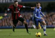 Chelsea's Eden Hazard (R) challenges West Bromwich Albion's Morgan Amalfitano during their English Premier League soccer match at Stamford Bridge in London November 9, 2013.