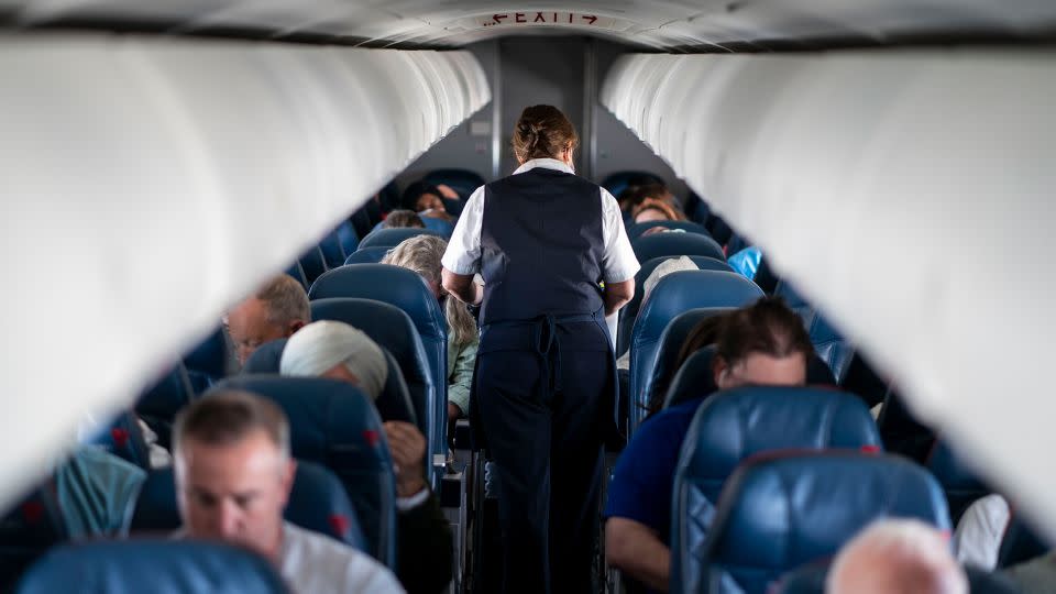 QUEENS, NY - MAY 04:  Passengers and flight attendants aboard a flight from LaGuardia Airport bound for Kansas City International Airport on Wednesday, May 4, 2022 in Queens, NY. (Kent Nishimura / Los Angeles Times via Getty Images) - Kent Nishimura/Los Angeles Times/Getty Images