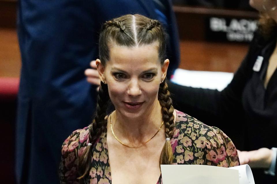 Michelle Ugenti-Rita, a Republican candidate running for Secretary of State for Arizona, talks with colleagues at the Arizona Capitol Monday, Jan. 10, 2022, in Phoenix. (AP Photo/Ross D. Franklin)