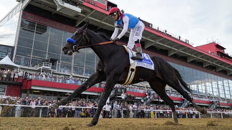 John Velazquez atop Medina Spirit competes during the 146th Preakness Stakes horse race at Pimlico Race Course, Saturday, May 15, in Baltimore. Kentucky Derby winner Medina Spirit collapsed and died after a workout Monday at Santa Anita. The 3-year-old colt trained by Bob Baffert had just completed five furlongs in his second workout since finishing second in the Breeders' Cup Classic a month ago at Del Mar, according to Craig Robertson, Baffert's attorney.