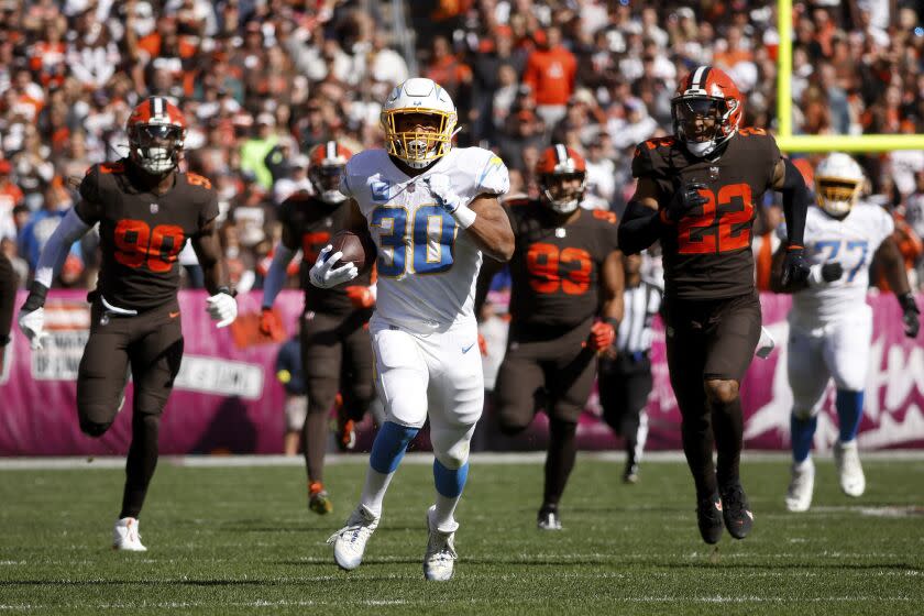 Los Angeles Chargers running back Austin Ekeler (30) runs with the ball.