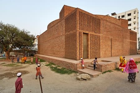 Boys play outside Bait Ur Rouf Mosque in Dhaka, Bangladesh April 24, 2016. Picture taken April 24, 2016. Aga Khan Award for Architecture/Handout via REUTERS