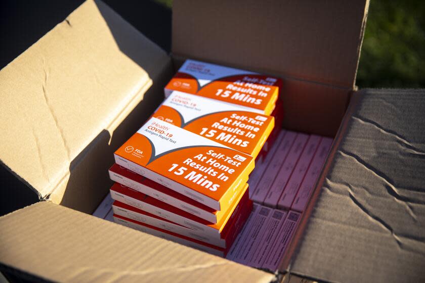 Redondo Beach, CA - January 06: Boxes of iHealth COVID-19 Antigen Rapid Test kits, provided by the state of California, are ready for parents to pick up, at Tulita Elementary School, as positive COVID-19 cases spike with the spread of the Omicron strain, in Redondo Beach, CA, Thursday, Jan. 6, 2022. (Jay L. Clendenin / Los Angeles Times)