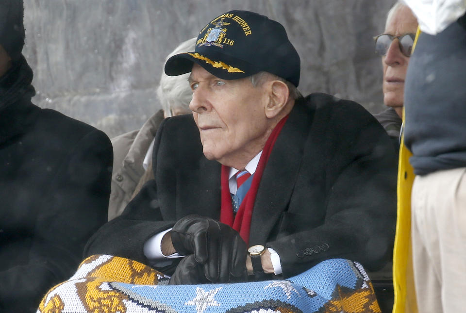 FILE - In this April 1, 2017 file photo, Korean War veteran Thomas Hudner looks on during the christening ceremony for the future USS Thomas Hudner, a U.S. Navy destroyer named in his honor, at Bath Iron Works in Bath, Maine. The ship will be commissioned Saturday, Dec. 1, 2018 in Boston. (AP Photo/Mary Schwalm, File)