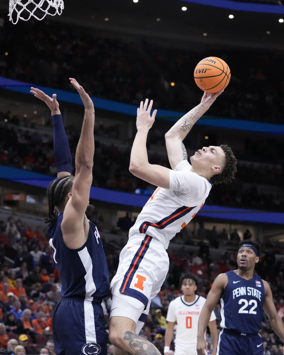 Illinois's Coleman Hawkins shoots over Penn State's Seth Lundy during the second half of an NCAA college basketball game at the Big Ten men's tournament, Thursday, March 9, 2023, in Chicago. Penn State won 79-76. (AP Photo/Charles Rex Arbogast)