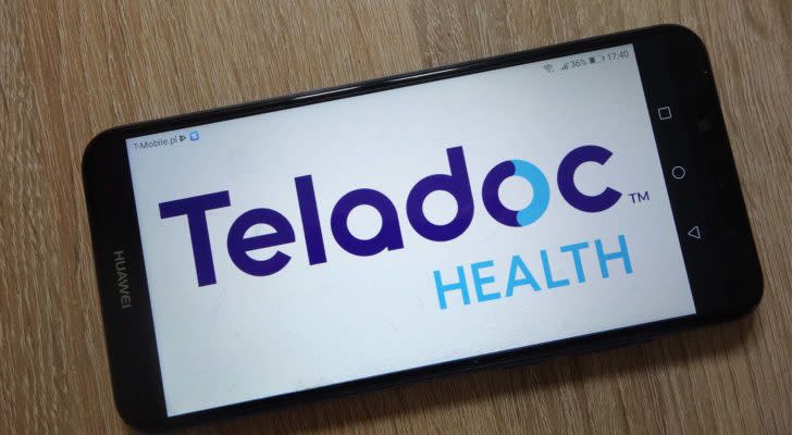 Teladoc Health (TDOC) logo on a mobile phone screen