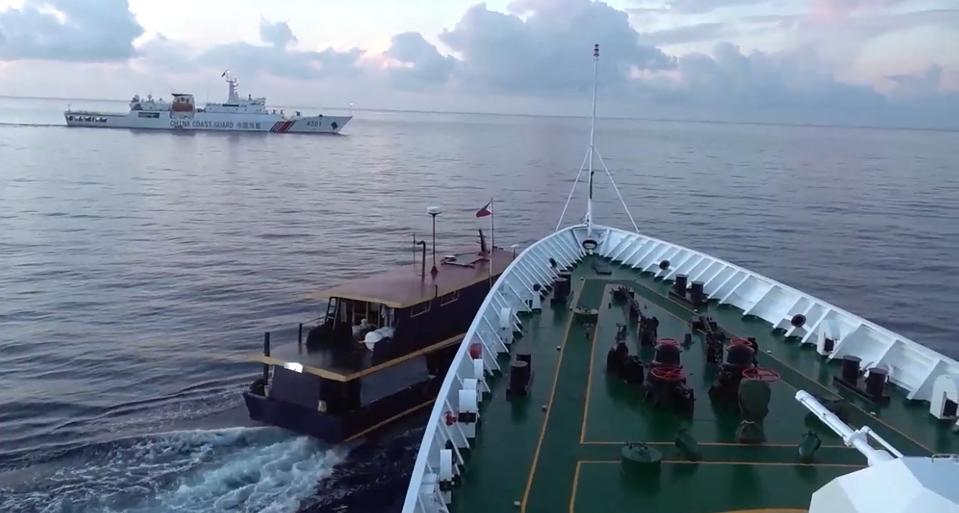In this video grab taken from a video released by the Chinese Coast Guard (CCG) through the Chinese embassy in Manila on October 23, 2023 shows a collision between Chinese Coast Guard ship (R) and Philippines’ resupply boat (L) during a resupply mission in Second Thomas Shoal (Chinese Coast Guard /AFP via Get)