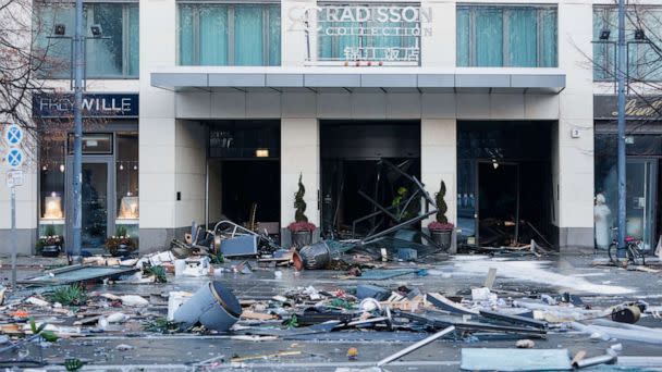 PHOTO: Debris covers a street outside a hotel after the AquaDom aquarium burst inside the hotel in Berlin, Dec. 16, 2022. (Michele Tantussi/Reuters)