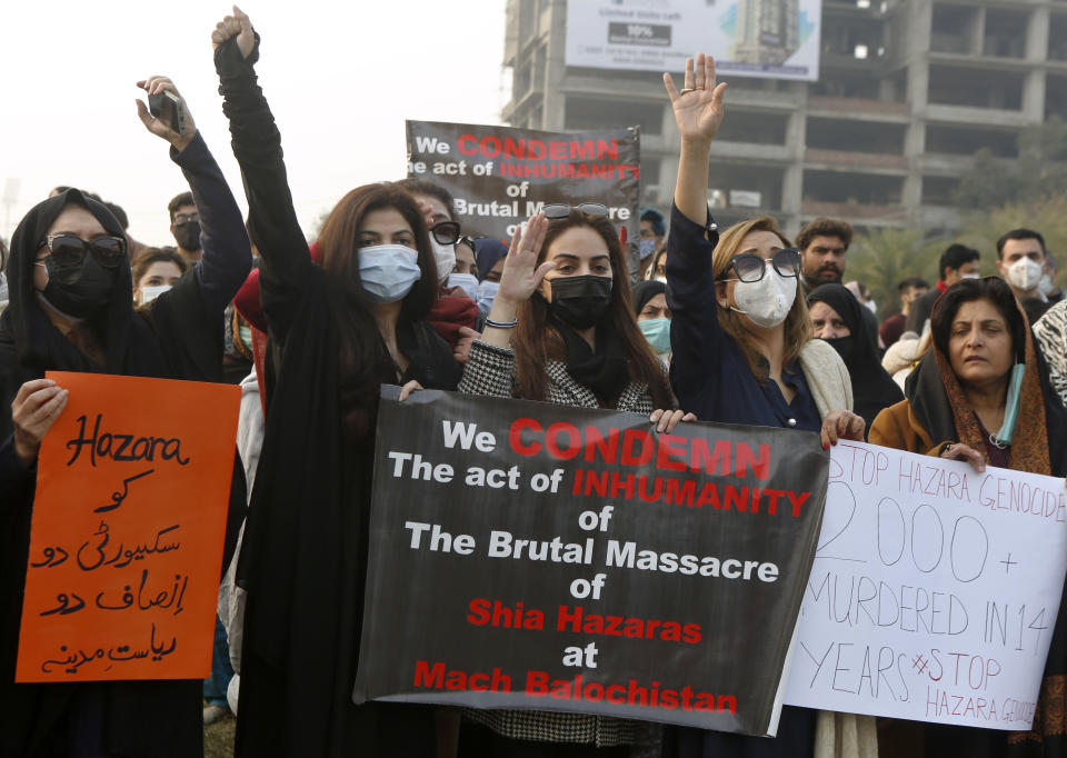 Supporters of a civil society organization hold a demonstration to protest the killing of coal mine workers by gunmen near the Machh coal field, in Lahore, Pakistan, Thursday, Jan. 7, 2021. Pakistan's minority Shiites continued their sit-in for a fifth straight day insisting they will bury their dead only when Prime Minister Imran Khan personally visits them to assure protection. (AP Photo/K.M. Chaudary)