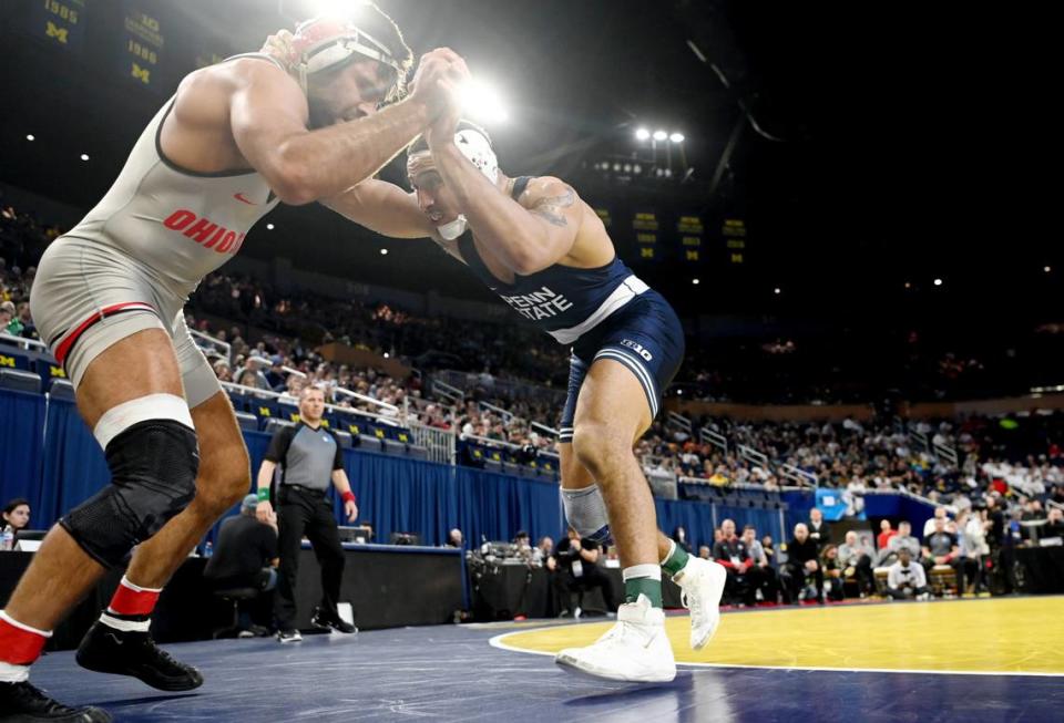 Penn State’s Aaron Brooks pushes Ohio State’s Kaleb Romero out of bounds during the 184 lb championship bout of the Big Ten wrestling championships at the Crisler Center on Sunday, March 5, 2023.