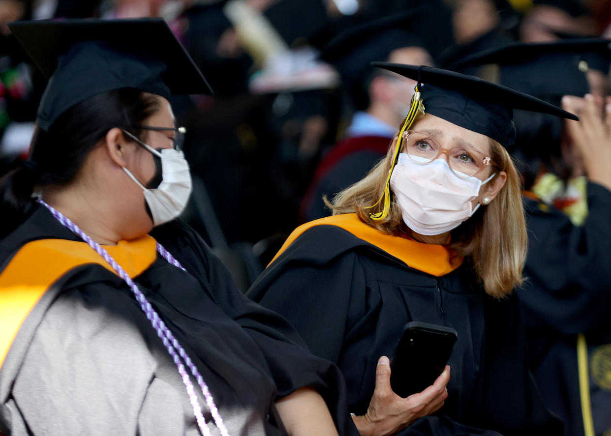 Cal State Los Angeles graduates prepare for their commencement ceremony which was held outdoors beneath a tent on campus on July 27, 2021 in Los Angeles, California. (Photo by Mario Tama/Getty Images)