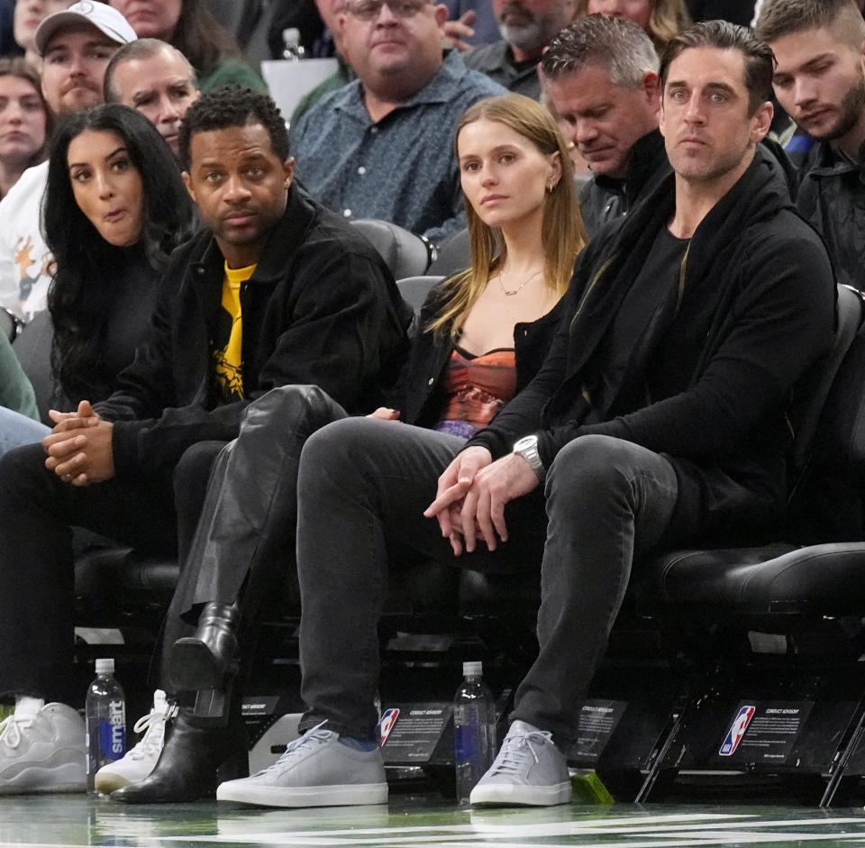 Green Bay Packers quarterback Aaron Rodgers, right, Mallory Edens, center, and Packers wide receiver Randall Cobb take in the Milwaukee Bucks-Los Angeles Lakers game Dec. 2 at Fiserv Forum in Milwaukee.