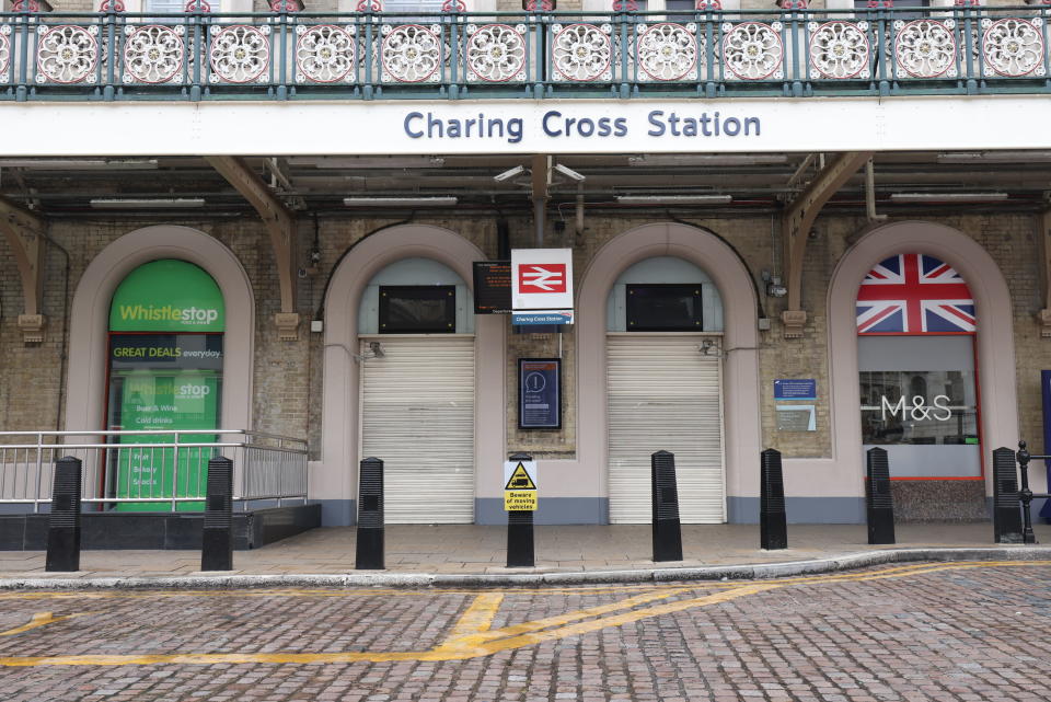 Closed gates at Charing Cross Station, central London, as train services continue to be disrupted following the nationwide strike by members of the Rail, Maritime and Transport union in a bitter dispute over pay, jobs and conditions, in London, England, Thursday, June 23, 2022. (James Manning/PA via AP)