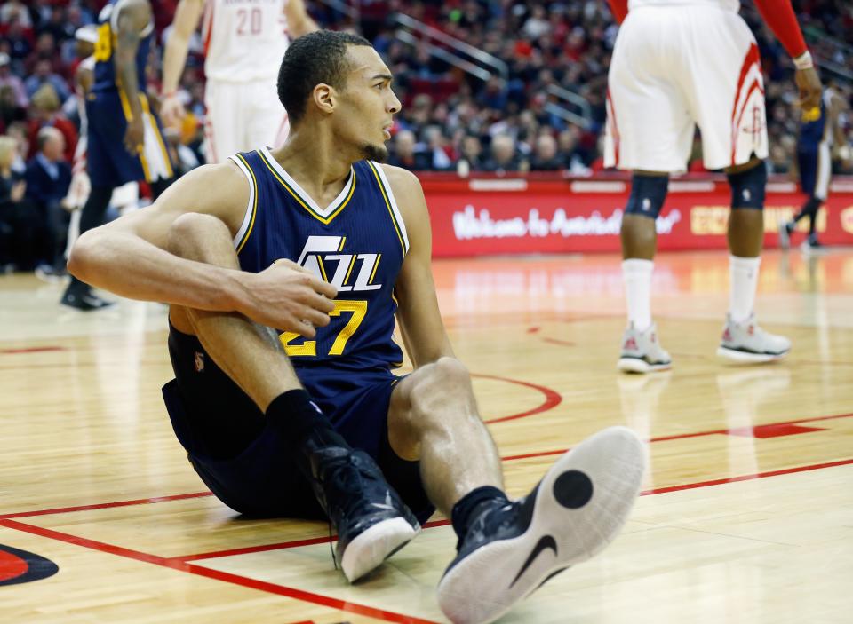 HOUSTON, TX - JANUARY 10:  Rudy Gobert #27 of the Utah Jazz sits on the court after a foul against the Houston Rockets during their game at the Toyota Center on January 10, 2015 in Houston, Texas.  NOTE TO USER: User expressly acknowledges and agrees that, by downloading and/or using this photograph, user is consenting to the terms and conditions of the Getty Images License Agreement.  (Photo by Scott Halleran/Getty Images)