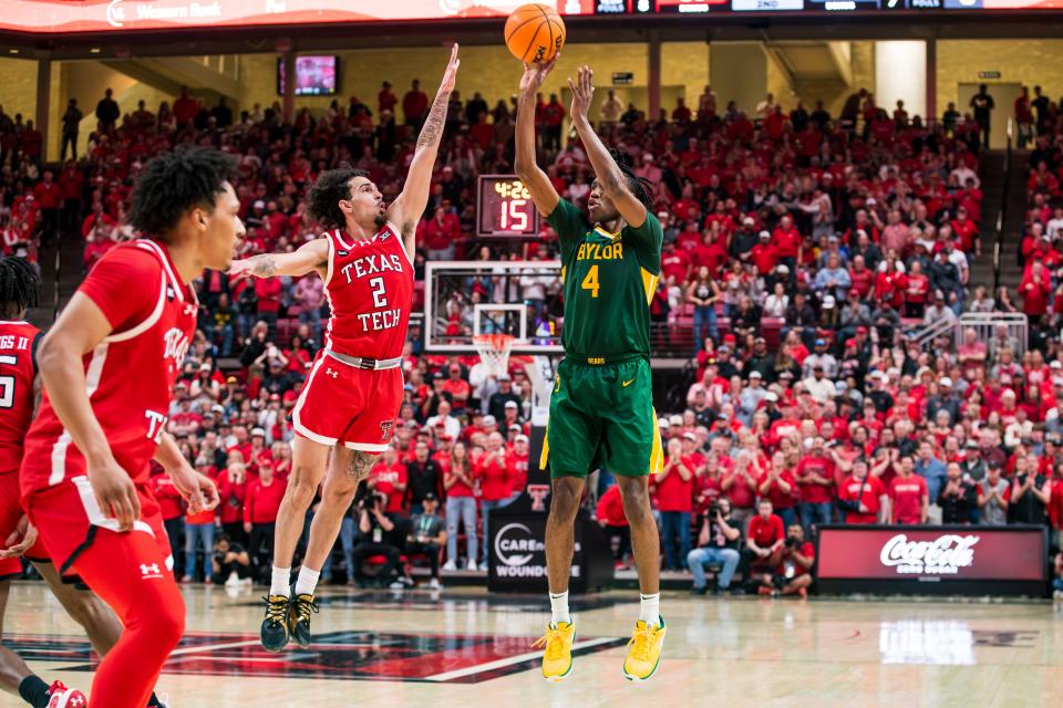 Ja'Kobe Walter #4 of Baylor shoots the ball over Pop Isaacs #2 of Texas Tech during the second half of the game at United Supermarkets Arena on Saturday, March 09, 2024 in Lubbock, Texas.